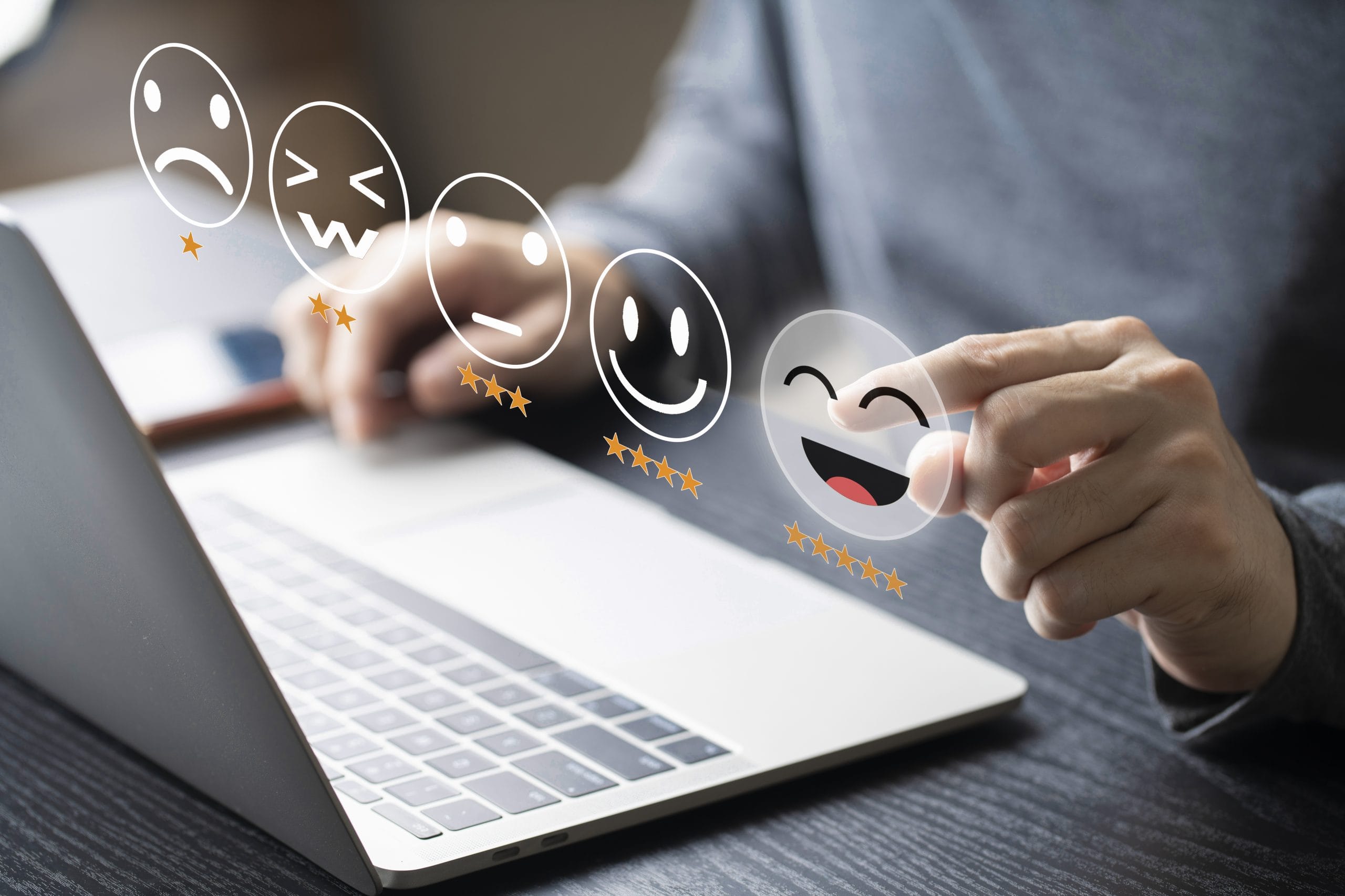 Businessman using computer laptop with popup rating icon for fee